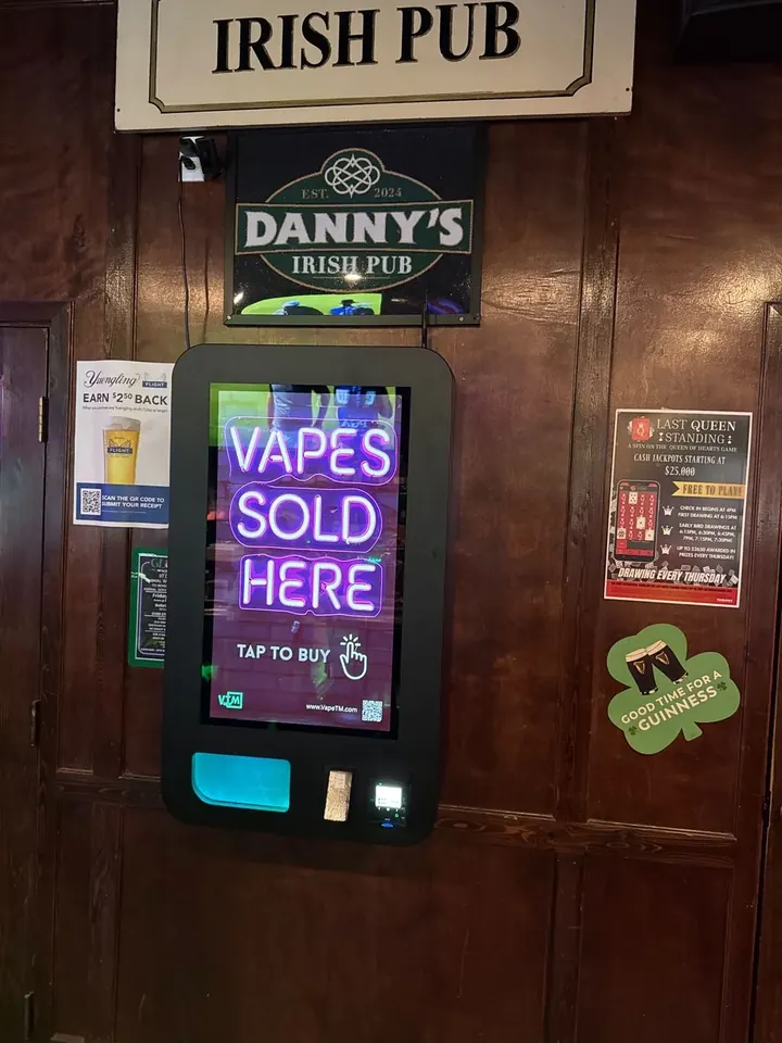 Wall-mounted vape machine in an Irish pub